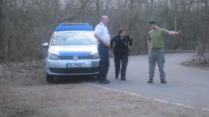 Police arrive and speak to man in green beret